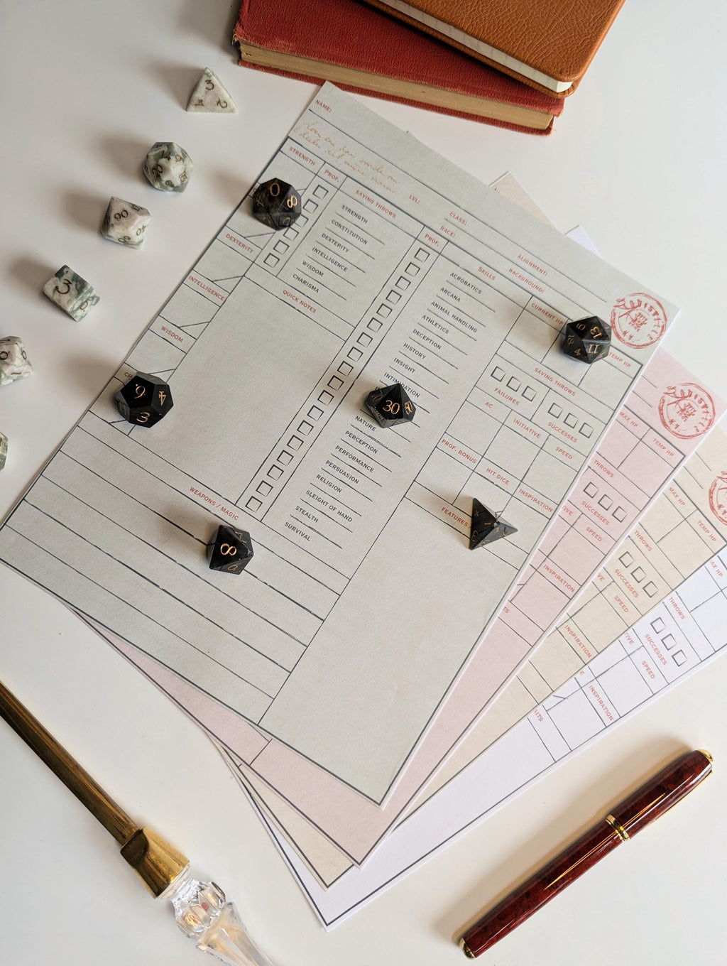 dnd character sheets with dice and a pen on a white surface