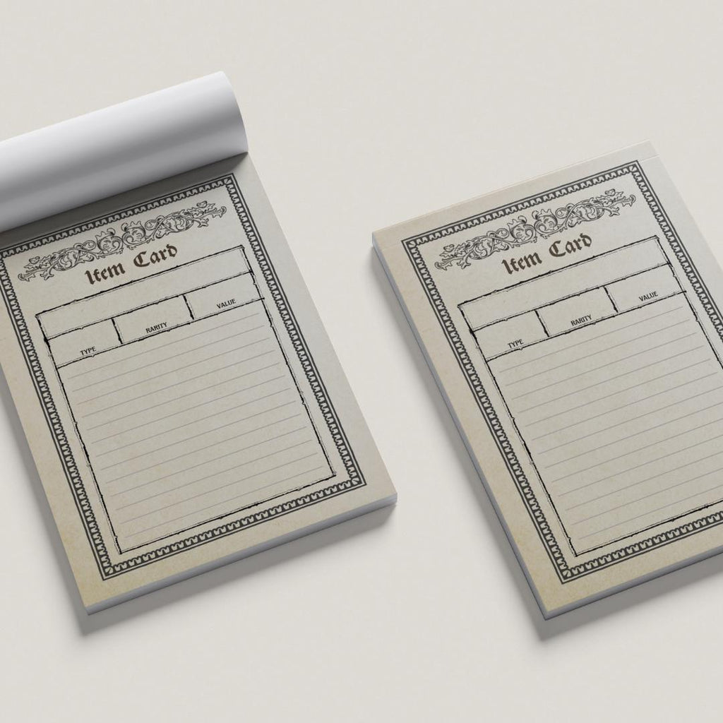 Two item card pads with decorative borders on a light gray background