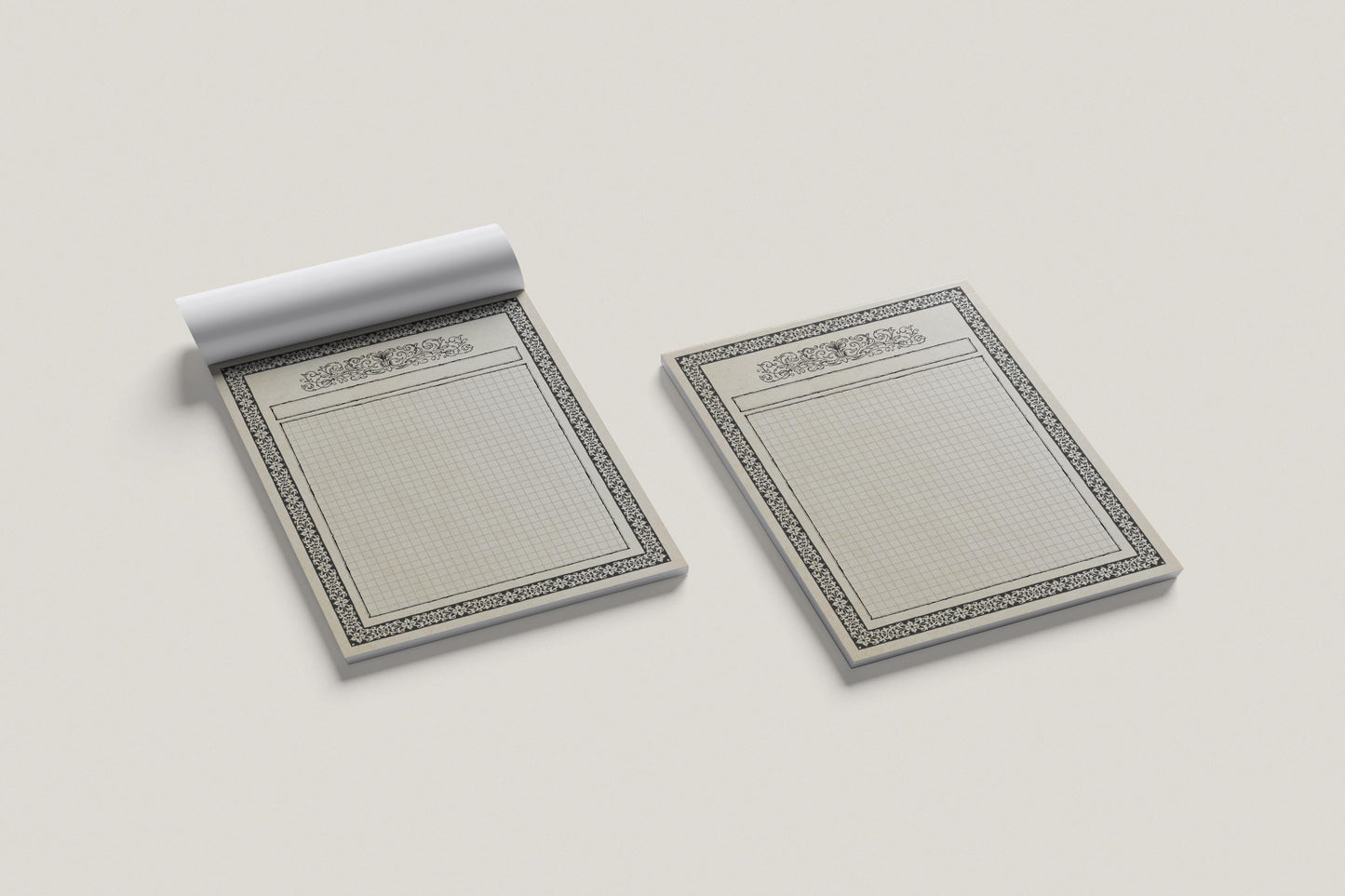 Two map pads with decorative edges on a light gray background