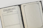 Open dungeons and dragons notebook with 'Session Planner' on one page and lined pages on the other