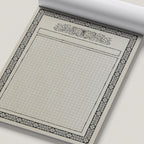 dnd map pad with grid paper and decorative border on a white background