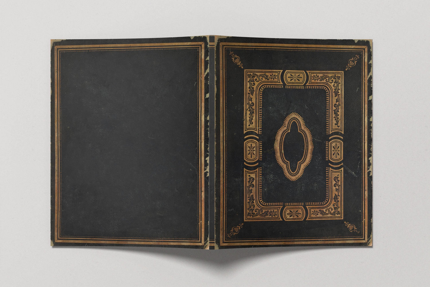 Open black book with gold decorative elements
