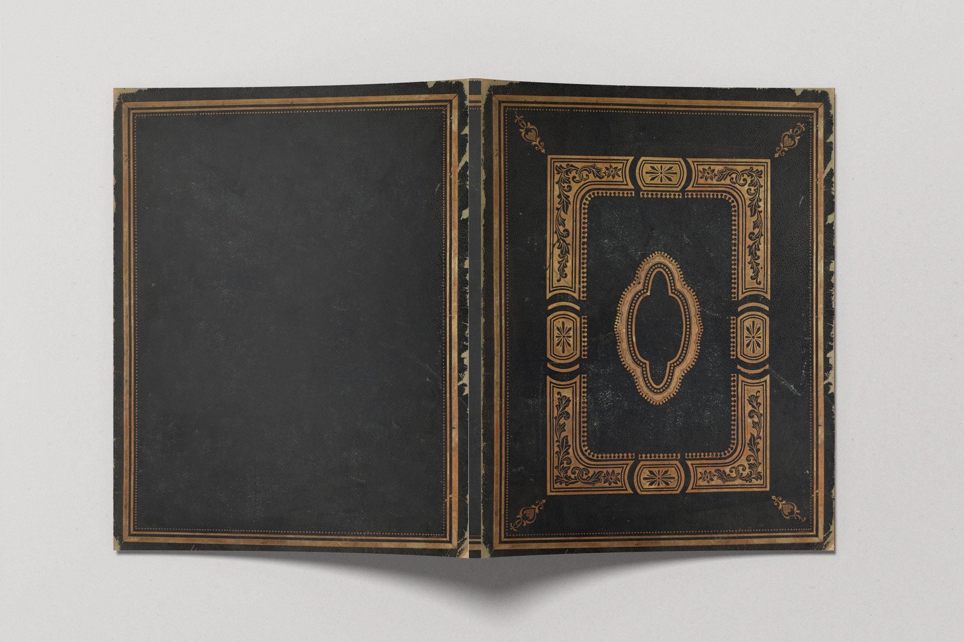 Open black book with gold decorative elements