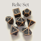 A set of polyhedral tabletop gaming dice labeled 'Relic Set' at the top, featuring a warm beige base with dark gray ornate scrollwork and engraved numbers on a light neutral background.