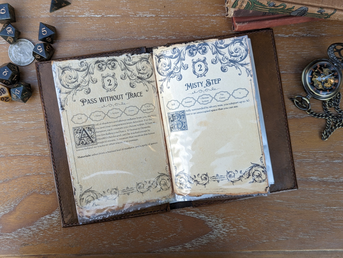 a photo of an open dnd spellbook next to dice and a stopwatch