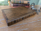 back view of a dnd leather spellbook