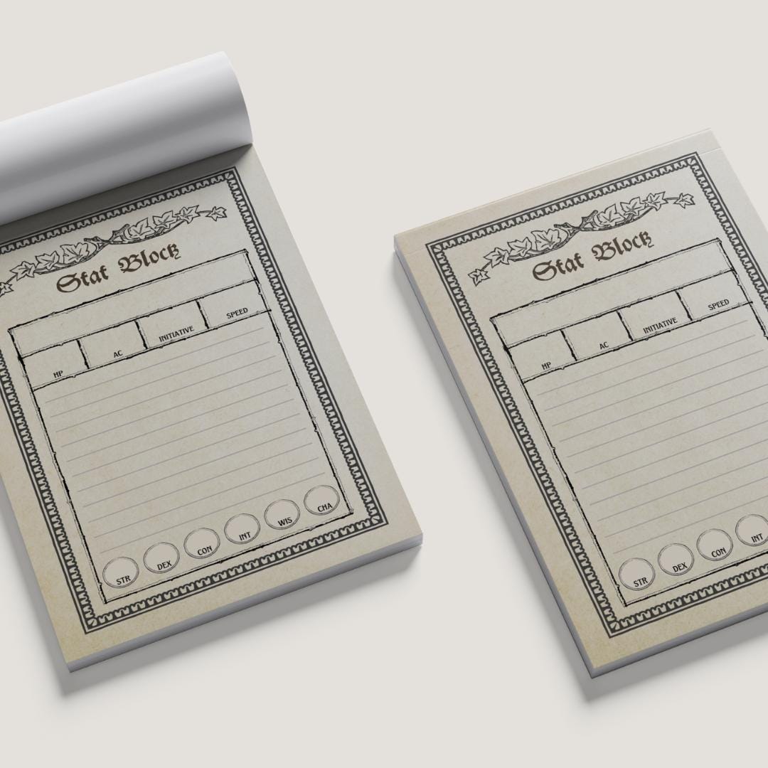 Two notepads with 'Stat Block' design on a white background