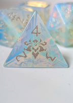 Close-up of The Moonveil opalite D4 showing its translucent blue finish and decorative silver details
