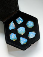 The Moonveil 7-piece opalite D&D dice set displayed inside its protective storage case