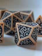 Close-up of The Relic polyhedral dice showing intricate black number and border details